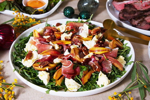 Our Famous Grilled Peach & Prosciutto Salad with Mozzarella, Pecans & Maple Dressing