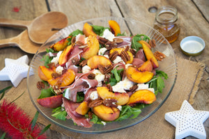 Our Famous Grilled Peach & Prosciutto Salad with Mozzarella, Pecans & Maple Dressing